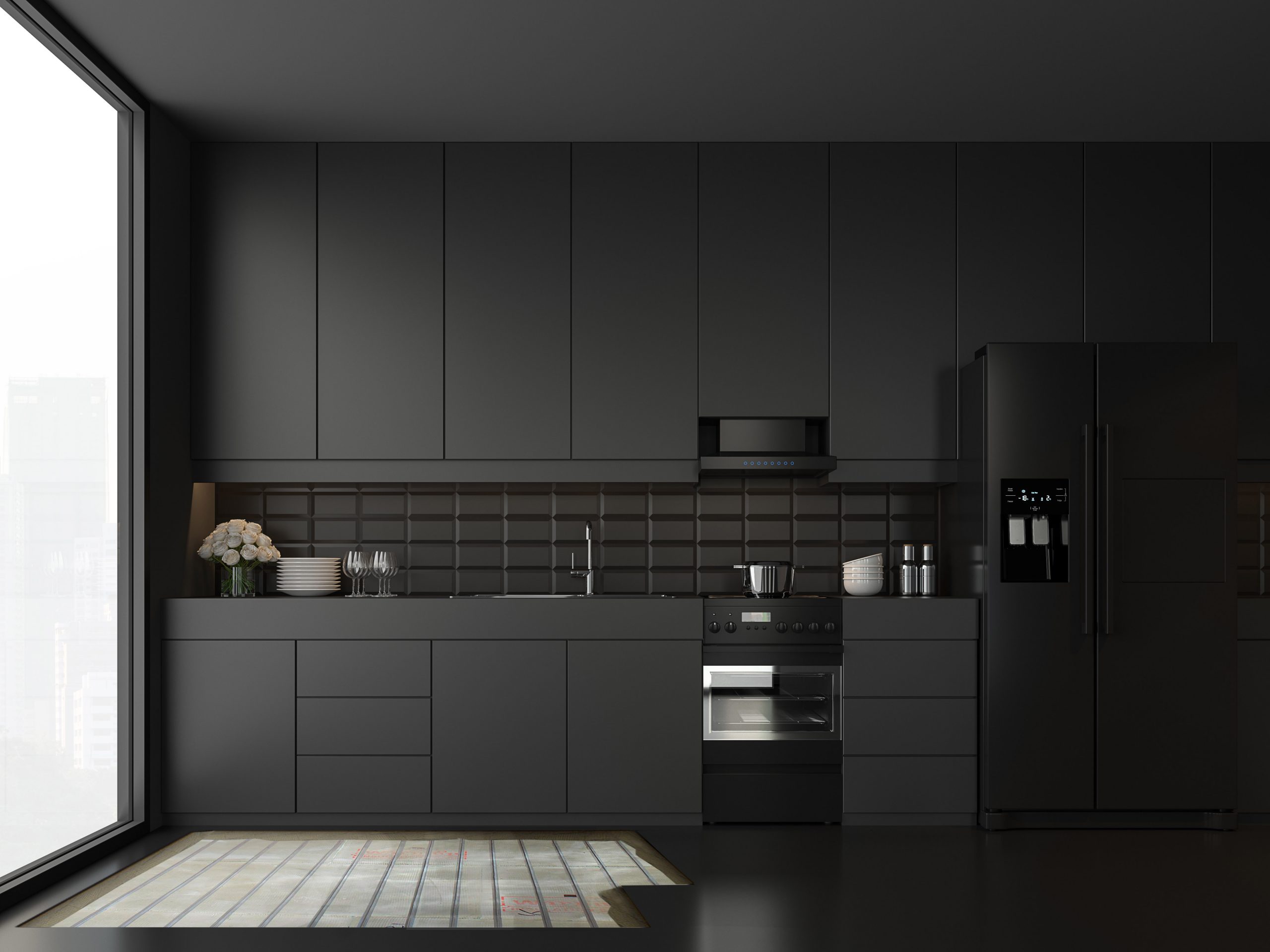 Cocina con mobiliario negro y calefacción radiante eléctrico